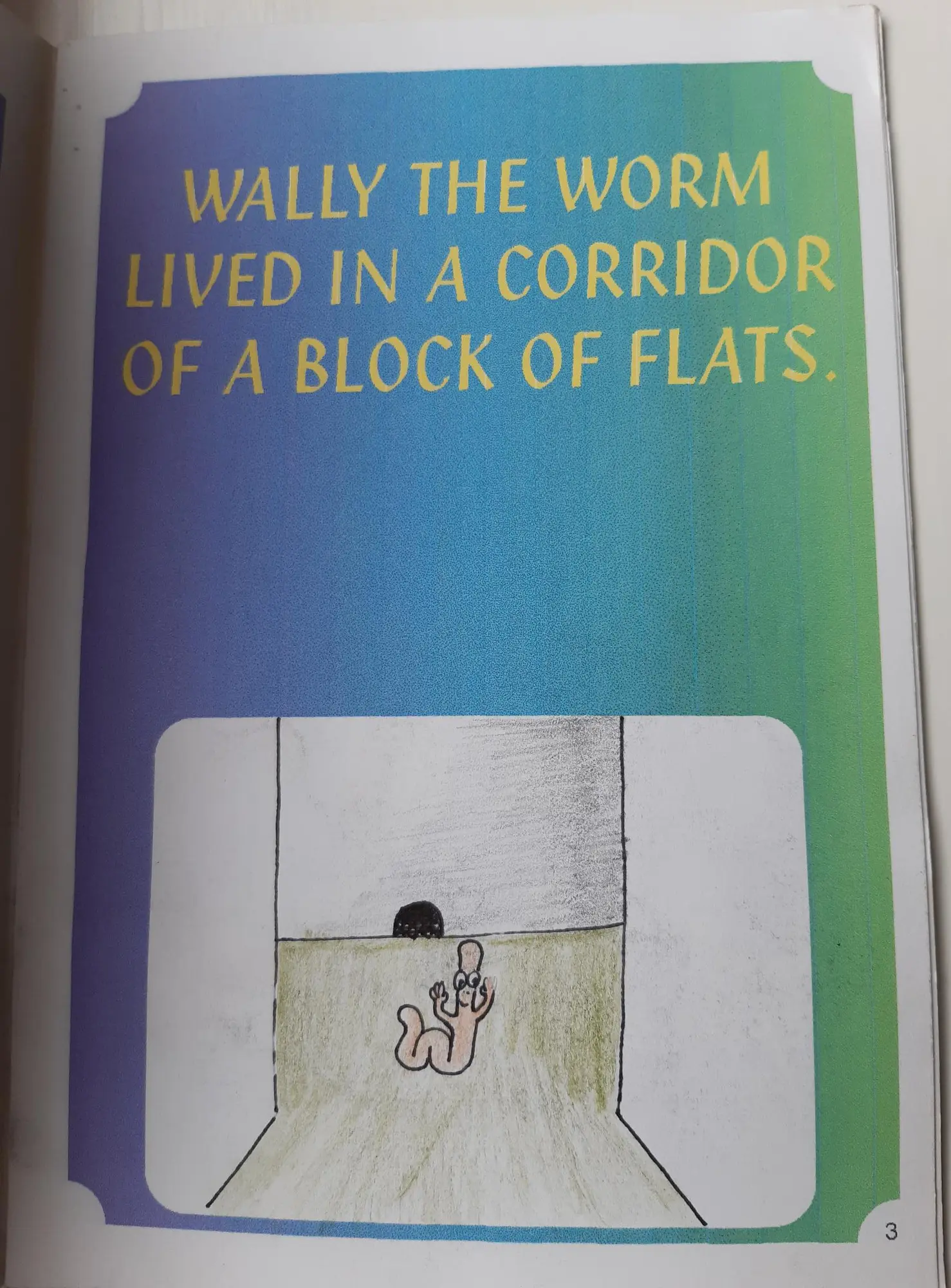 Page 3 of 16 of Alex’s school book. Wally the Worm lived in a corridor of a block of flats. Drawing: Wally in a corridor beside a hole in the wall.